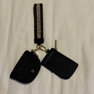 Used. Lululemon Dual Wristlet Pouch Black & Gold.